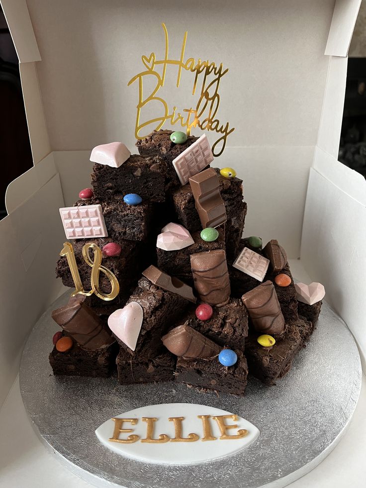 a birthday cake made to look like it is stacked on top of each other in a box