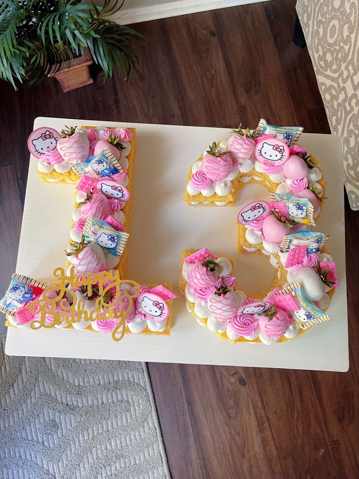 a cake that has the letter s made out of cupcakes and icing