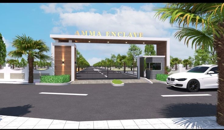 a white car is parked in front of a gated entrance to an upscale residence