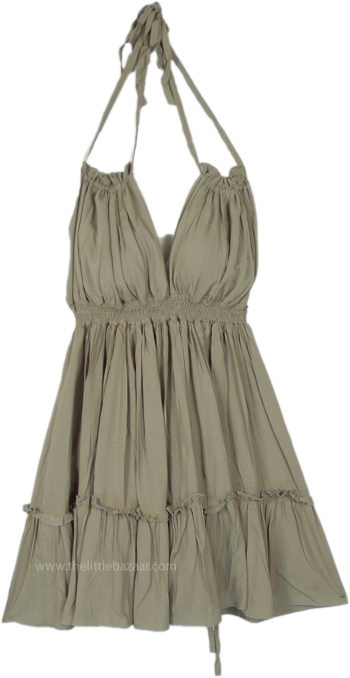 This chic olive green dress is crafted from soft, breathable rayon, making it a perfect choice for warm weather.  It features a unique halter neck design with adjustable ties, allowing for a custom fit. #tlb #vacationclothing #beachwrap #Solid #SummerDress #westerndress Green Bohemian Halter Dress For Vacation, Green Backless Halter Top For Vacation, Bohemian Green Halter Dress For Vacation, Green Bohemian Halter Dress For Summer, Green Sundress Halter Dress For Beach, Green Sundress Halter Dress For The Beach, Green Halter Sundress For The Beach, Green Halter Sundress For Vacation, Casual Cotton Halter Dress For Vacation