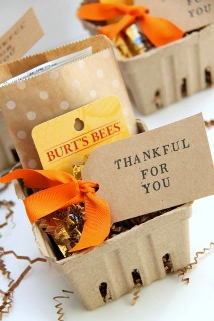 two small boxes filled with candies on top of a table