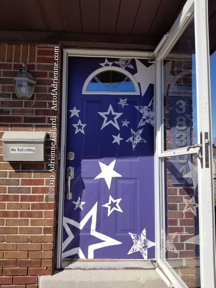 a purple door with white stars painted on it