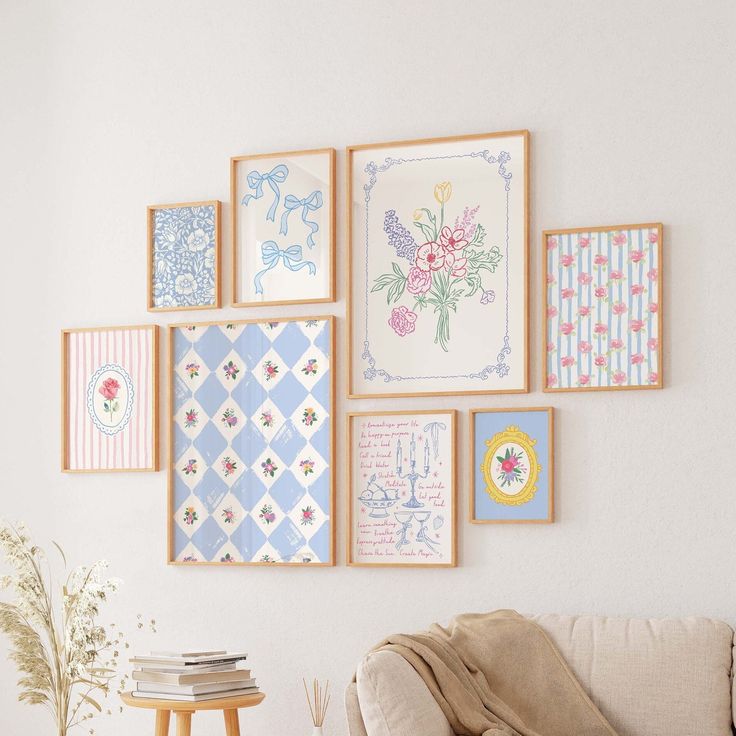 a living room filled with lots of framed pictures on the wall next to a couch