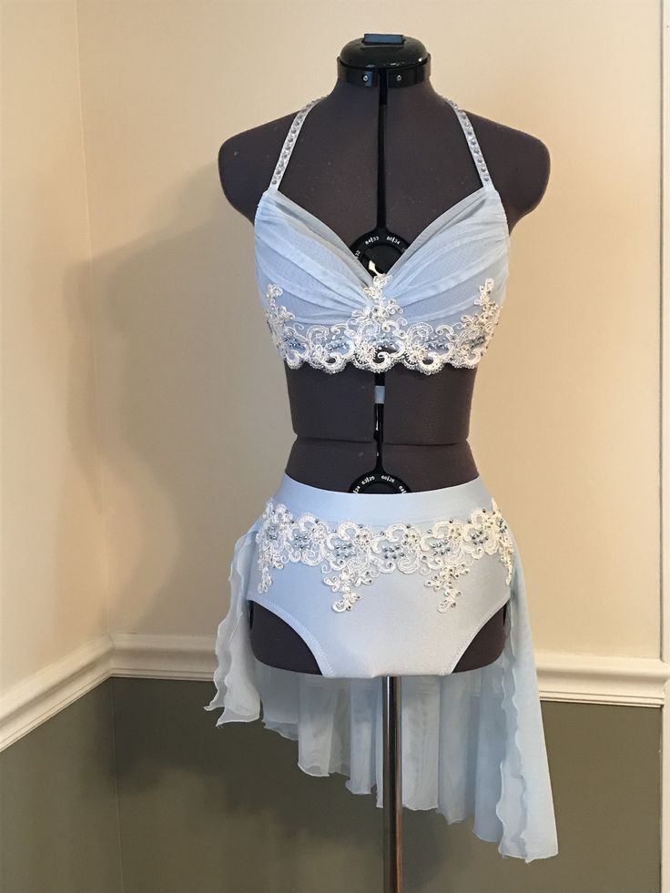 a mannequin wearing a white bra and skirt