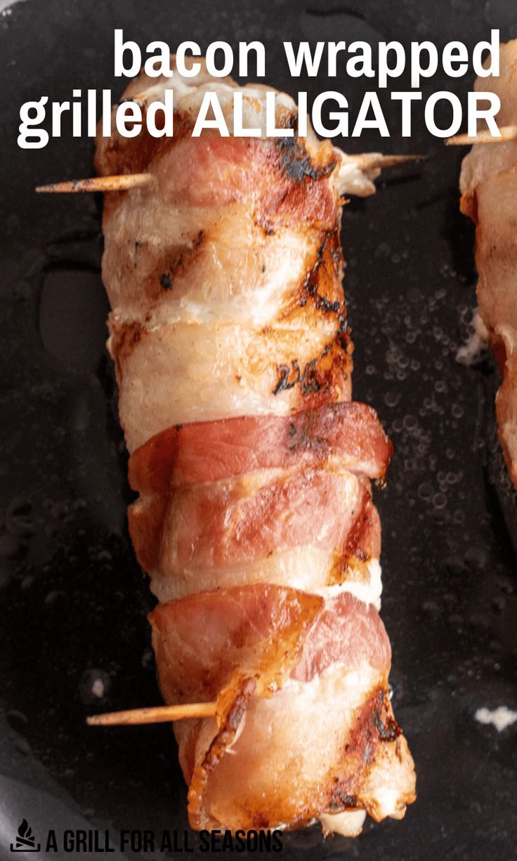 bacon wrapped grilled alligator on skewers in a skillet with text overlay