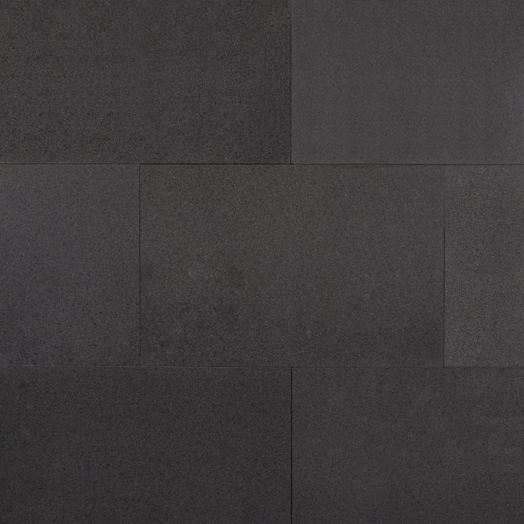 a black wall with several squares on it