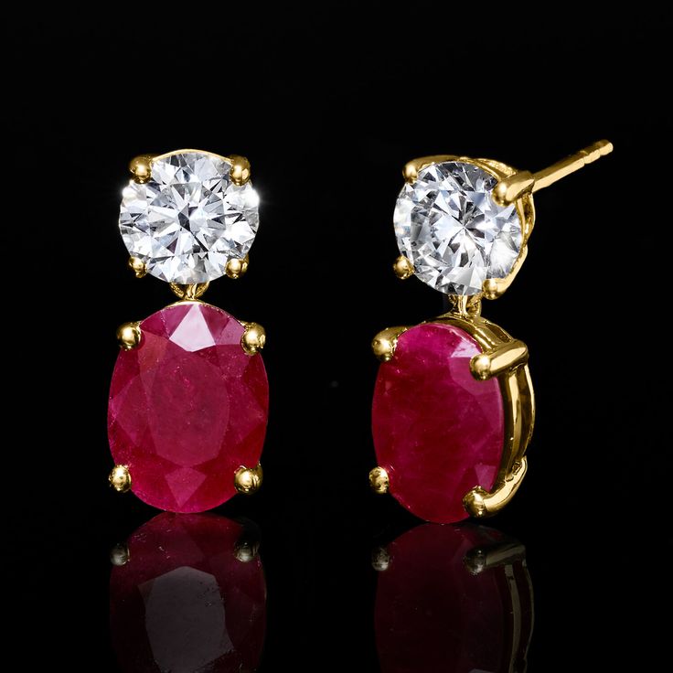 Ross-Simons - 3.20ct t. w. Ruby, 1.00ct t. w. Lab Grown Diamond Drop Earrings in 14kt Yellow Gold. An RS exclusive. Treat yourself to a unique blend of lab-grown diamonds and mined precious gemstones at an incredible value. These dazzling drop earrings feature fiery 3.20 ct. t. w. oval rubies topped with icy sparkle from 1.00 ct. t. w. round brilliant-cut lab-grown diamond tops. Finely crafted in polished 14kt yellow gold. Lab-grown diamonds are identical to mined diamonds according to their opt Classic Ruby Diamond Earrings With Accents, Classic Ruby Diamond Earrings With Diamond Accents, Classic Red Diamond Earrings With Brilliant Cut, Classic Oval Diamond Earrings Aaa Quality, Ruby Top, Diamond Tops, Pure Design, Earrings In Gold, Diamond Drops