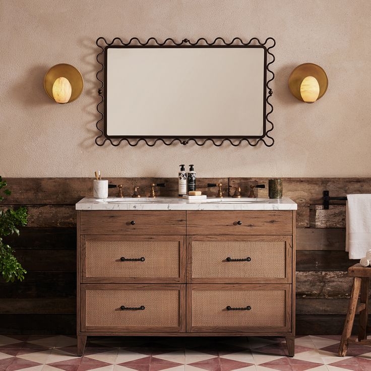 a bathroom vanity with two mirrors above it