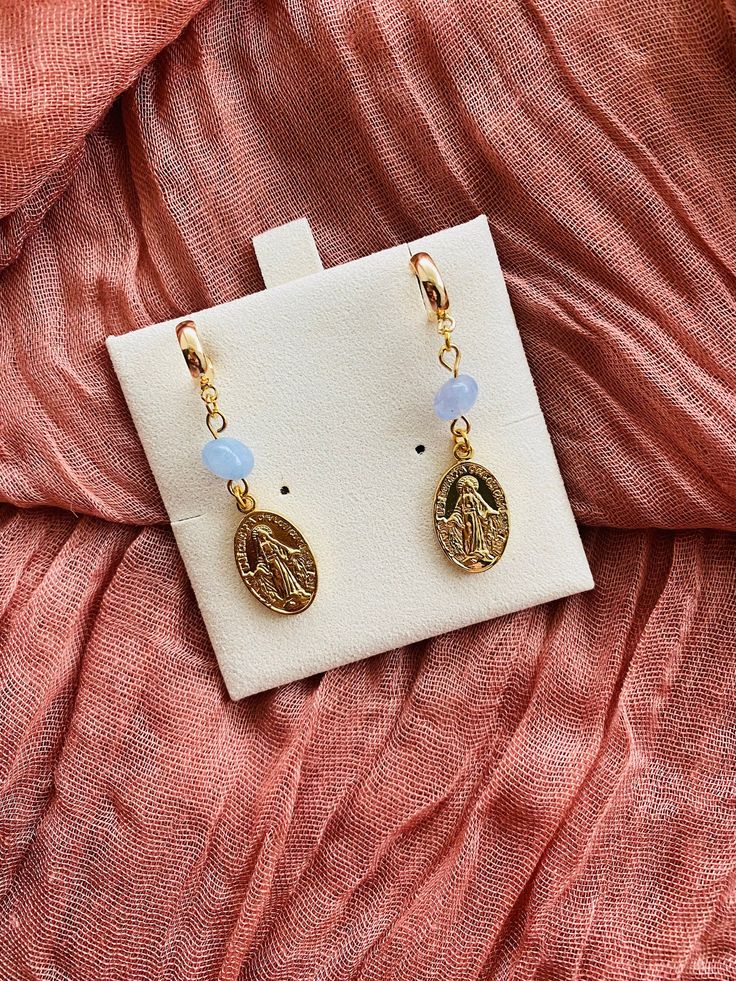 Half hoop gold Marian medal earrings 18k gold with blue bead. Blue Marian jewelry, Virgin Mary earrings, hoop religious earrings, Blessed Mother Catholic jewelry, drop earrings, dangling earrings Catholic, Holy Mother earrings, blue beaded earrings, gold plated hoop earrings, gold plated religious jewelry, Mother's Day gift, anniversary gift for her, confirmation gift for her, birthday religious Catholic women, Catholic gifts for girls women, Catholic bridesmaid gifts, gifts for Bride Catholic, gifts for grandma religious, gifts for grandmother, gifts for Godmother Jewelry Virgin Mary, Mother Mary Earrings, Vintage Catholic Jewelry, Oval Virgin Mary Jewelry Gift, Oval Our Lady Of Guadalupe Jewelry Gift, Blue Beaded Earrings, Godmother Gifts, Catholic Jewelry, Confirmation Gifts