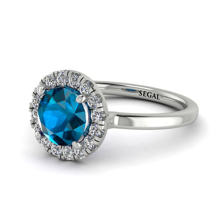 an oval blue topaz engagement ring with diamond halos