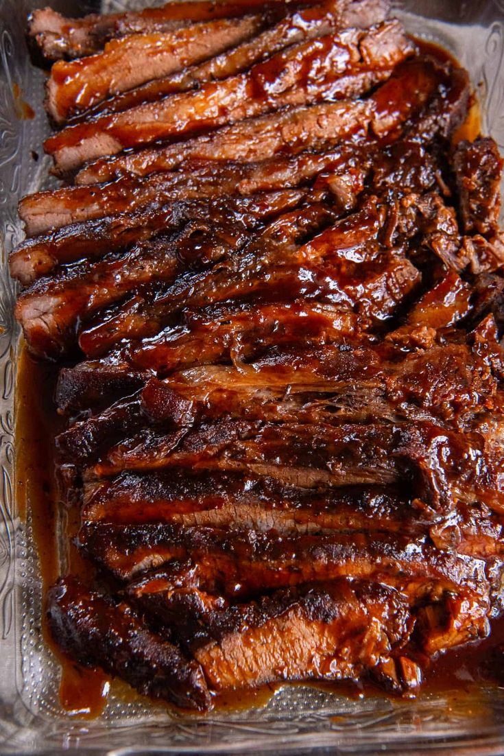 barbecue ribs in bbq sauce on a glass platter