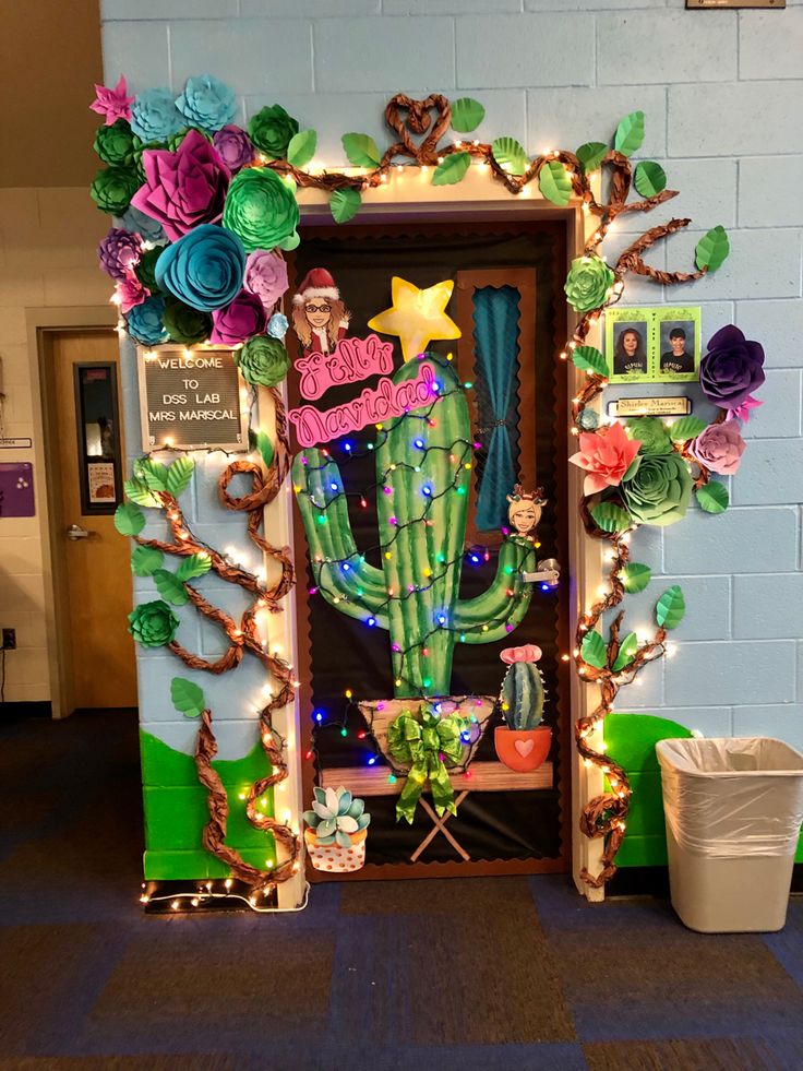 a decorated door in the shape of a cactus with lights and decorations on it's sides