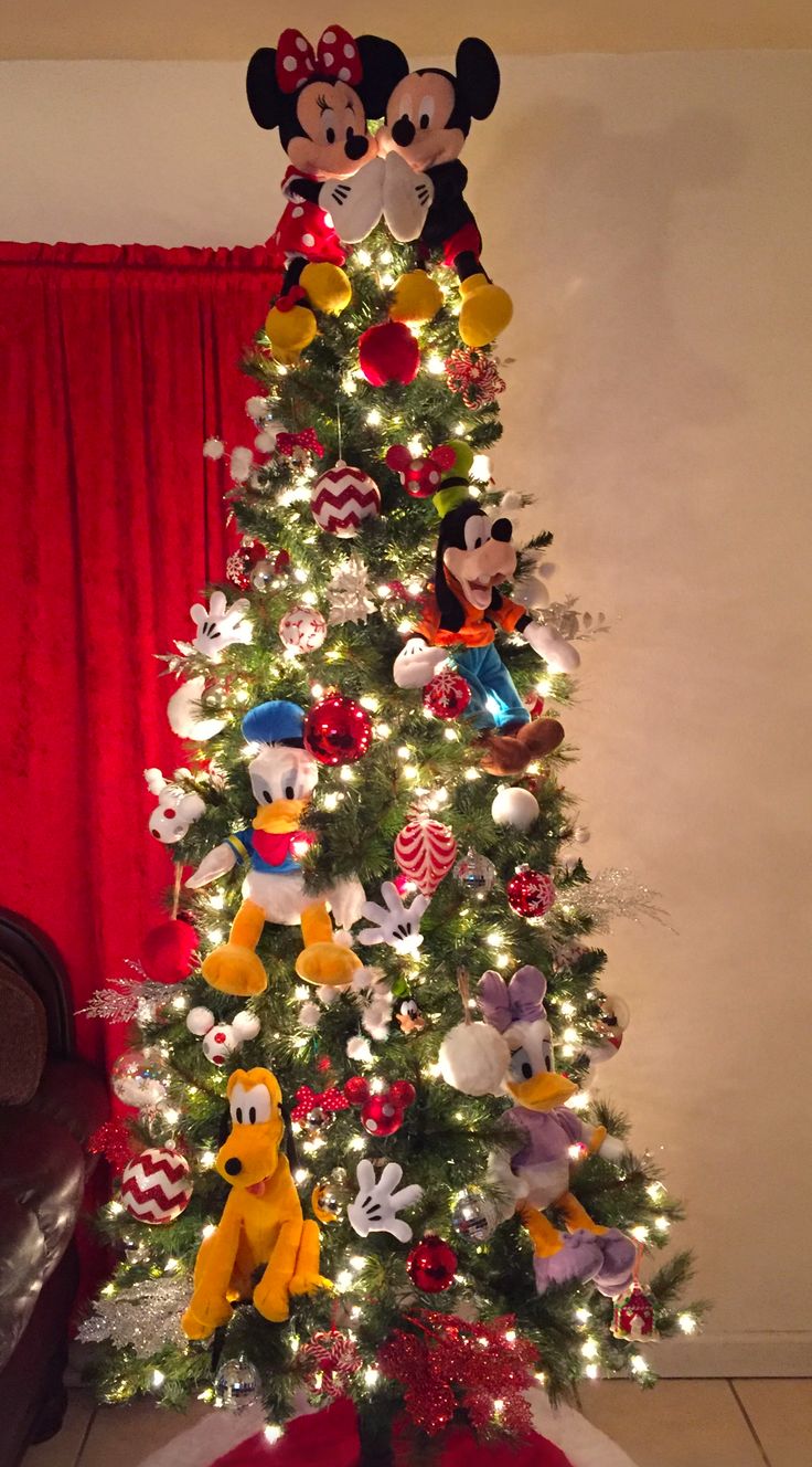 a christmas tree with mickey and minnie mouse decorations