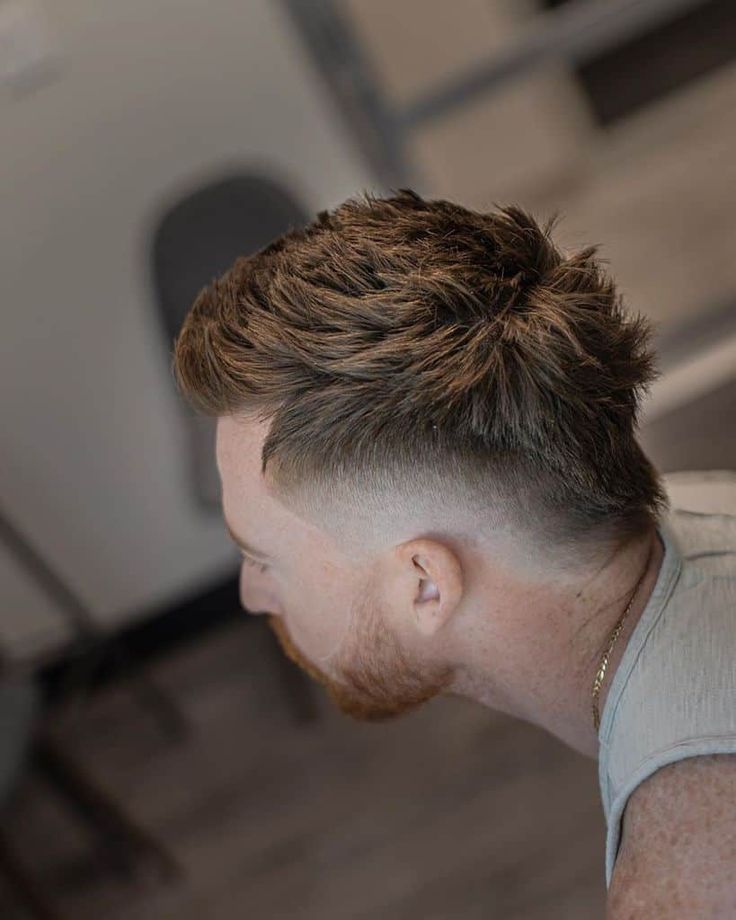 A Mohawk cut with hair extending from front to nape and barely noticeable fading on the sides Cyberpunk Hairstyles, Mid Fade Haircut, Short Hair With Beard, Round Face Men, Curly Afro Hair, Mohawk Hairstyles Men, Gents Hair Style, Mullet Haircut, Faded Hair