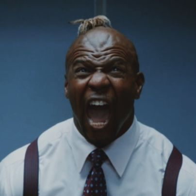 a man with his mouth open wearing suspenders and a white shirt is making an angry face