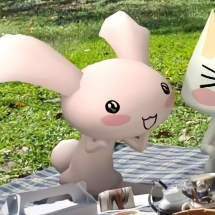 an animated rabbit sitting at a picnic table with food on it's plate and in front of him