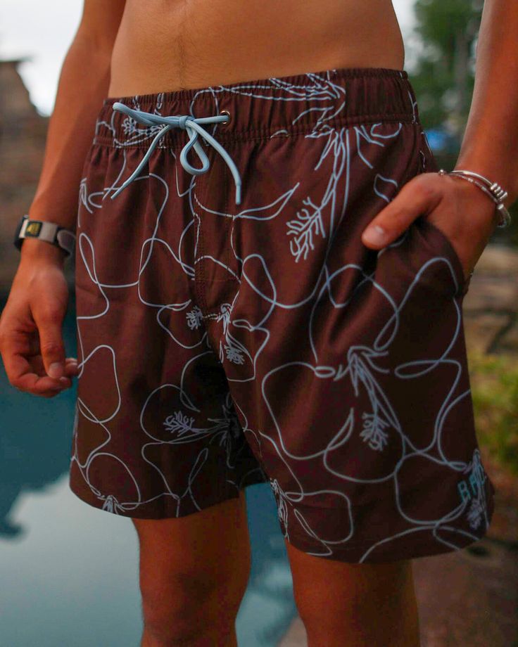 Your favorite swim trunks, now in a new print: Blue Hibiscus! And, they are seriously so RAD! Here are a few of our favorite features of the Chris: 4-way stretch Drawstring elastic waistband Back pocket with rivet No inner lining Rubber stamp Rad logo True to size Hawaiian Style Swim Trunks With Built-in Shorts For Poolside, Hawaiian Swim Trunks With Built-in Shorts For Vacation, Hawaiian Style Short Swim Trunks, Hawaiian Short Swim Trunks For Poolside, Hawaiian Swim Trunks With Built-in Shorts, Hawaiian Swim Trunks With Built-in Shorts For Poolside, Beachy Swim Trunks With Elastic Waistband For Vacation, Beachy Swim Trunks With Elastic Waistband For Poolside, Casual Brown Swimwear For Vacation