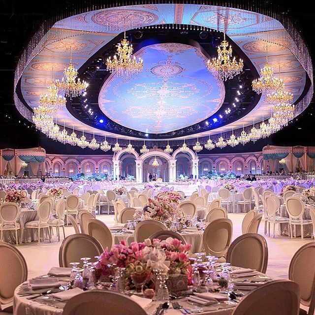 a large banquet hall with tables and chairs