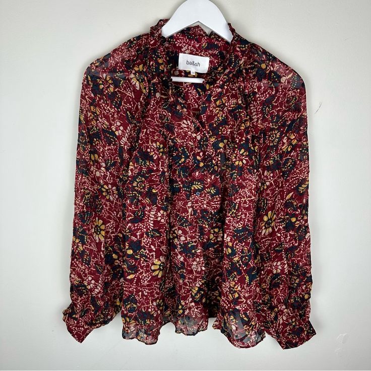 New With Tags Us Size 6 100% Viscose The Stunning Gaelle Blouse By Ba&Sh Has A Lovely Floral Print This Top Has A Frilly Round Collar, A V-Shaped Front Panel And 3/4 Sleeves With Frills Along The Raglan Armholes And Buttoned Cuffs. In Lightweight And Floaty Fabric, It's Slightly Sheer. The Perfect Blouse For Feeling Pretty This Winter. Floral Blouse Round Frilled Collar 3/4 Sleeves Red Floral Print Blouse For Work, Workwear Red Blouse With Floral Print, Red Fall Blouse For Daywear, Red Fall Blouse, Red Blouse For Fall, Red Blouse For Fall Daywear, Frilled Collar, Perfect Blouse, Winter Floral