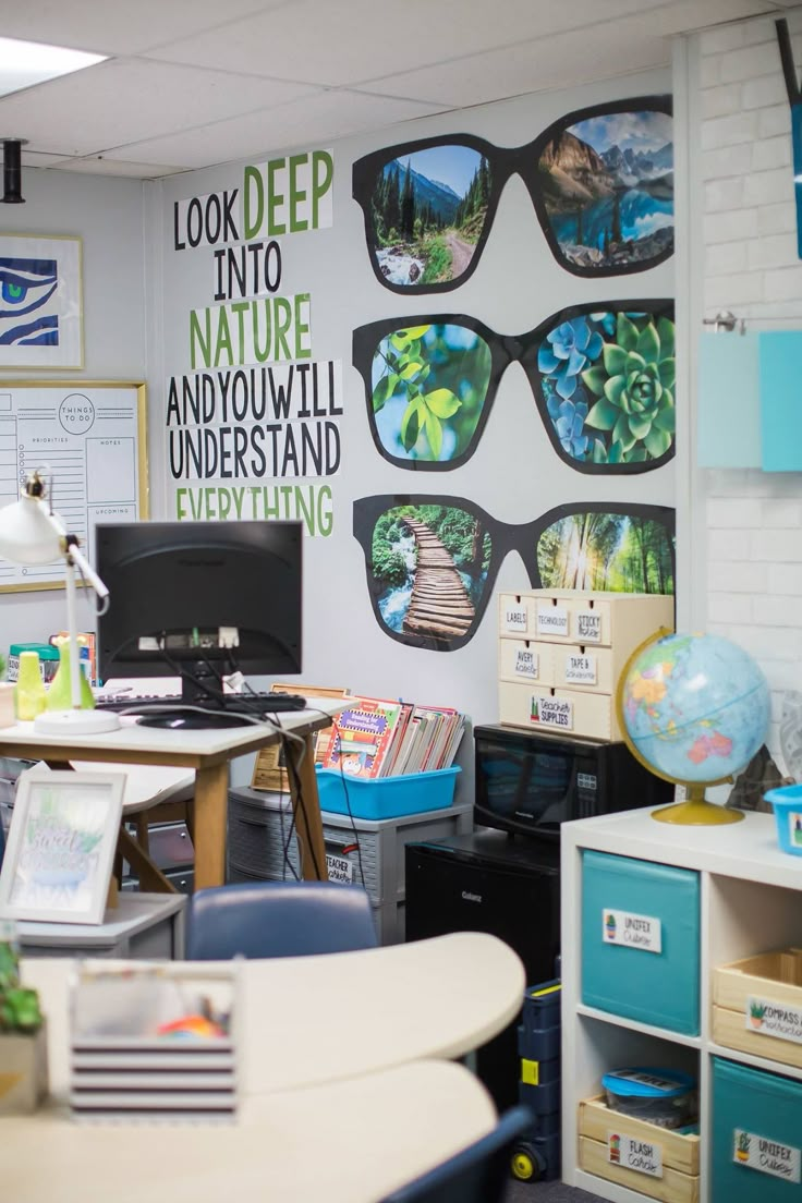 an office with desks, chairs and pictures on the wall