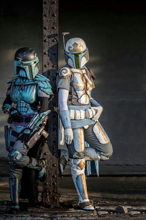 two people dressed as boba fett and star wars characters standing next to each other