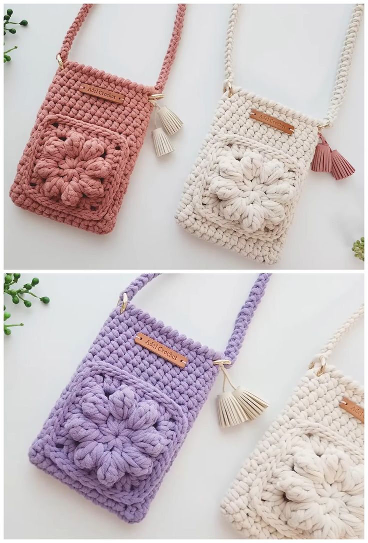 three crocheted purses with tasselled handles, one in pink and the other in purple