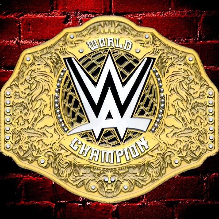 a gold wrestling belt with the word world champion on it in front of a red brick wall