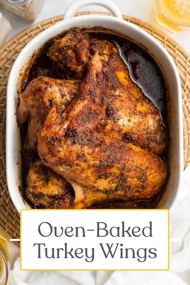 oven baked turkey wings in a white casserole dish with text overlay that reads, oven - baked turkey wings