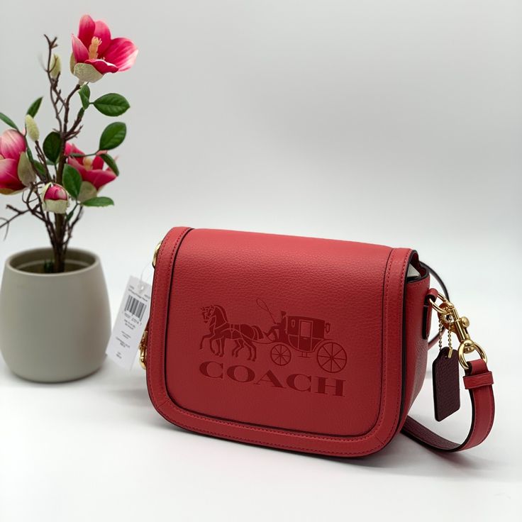 Refined Pebble Leather Inside Multifunction Pockets Magnetic Snap Closure, Fabric Lining Outside Open Pocket Detachable Strap With 22" Drop For Shoulder Or Crossbody Wear 8" (L) X 6" (H) X 3 1/4" (W) Color-Im/Poppy/Vintage Mauve Poppy Crossbody Coach, Luxury Red Saddle Bag With Detachable Strap, Luxury Red Saddle Bag For Formal Occasions, Red Rectangular Saddle Bag With Adjustable Strap, Red Saddle Bag With Detachable Strap And Top Handle, Red Saddle Bag With Detachable Strap, Luxury Red Saddle Shoulder Bag, Elegant Red Saddle Bag For Travel, Red Rectangular Saddle Bag With Removable Pouch