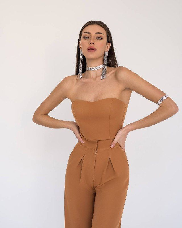 Fabric: Crepe Composition: cotton 65%, polyester 35% Included: jacket, corseted crop top, wide-leg pants and belt Wide-notched lapels High-rise pants Pants length (inseam): 95cm/ 37.5in Color: Black, White, Red, Camel Fitted Wide-leg Party Sets, Chic Two-piece Pantsuit For Party, Spring Cropped Fitted Pantsuit, Fitted Cropped Pantsuit For Spring, Chic Two-piece Pantsuit For Night Out, Chic High Waist Workwear Set, Chic High-waist Workwear Sets, Chic Two-piece Set With High-waisted Pants, Chic High Waist Two-piece Set