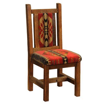 a wooden chair with a patterned seat cushion