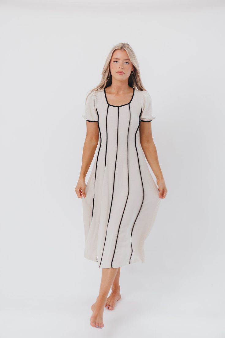 This one's a keeper, babe. The Andy Maxi Dress is a statement dress you'll love wearing out and about. It offers a scooped neckline, gently puffed sleeves, and a feminine silhouette that lends easy sophistication. Pair with your favorite mules or slides for a chic look in seconds. FIT: Runs true to size. MATERIAL: 70% Rayon, 30% Linen. GARMENT DETAILS: Easy-wear linen-blend maxi dress with scooped neckline, gently puffed short sleeves, and a fit-and-flare silhouette. Features contrast color bind Relaxed Fit Square Neck Dress For Day Out, Fitted Midi-length Puff Sleeve Dress For Day Out, Spring Chic Scoop Neck Maxi Dress, Fitted Puff Sleeve Midi Dress For Day Out, Fitted Midi Length Puff Sleeve Dress For Day Out, Chic Spring Maxi Dress With Scoop Neck, Relaxed Fit Square Neck Dress For Spring, Fitted Scoop Neck Maxi Dress For Spring, Spring Fitted Maxi Dress With Scoop Neck