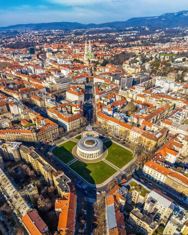 an aerial view of the city and surrounding buildings