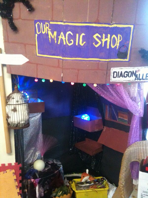 the entrance to a magic shop with many items in it