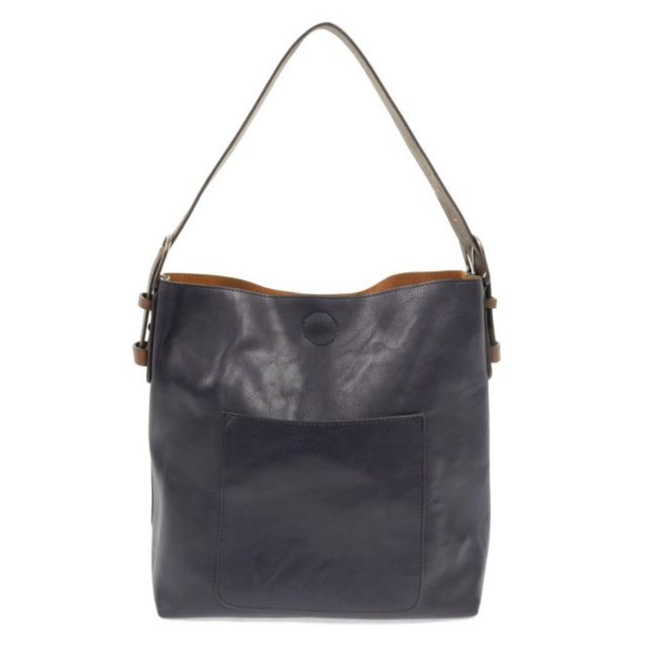 Equally timeless and modern, our best-selling classic hobo is made in rich vegan leather in beautiful colors always accented with neutral straps. This roomy bag accented with a large front pocket and a snap-in removable crossbody, has plenty of room to carry your needs in style. Product Details Main Bag Dimensions: 12 in. H x 14 in. W x 6 in. D Adjustable strap drop: 6-11 in.Magnetic snap top closure Exterior open pocket Two snaps to attach insert to act as lining Brass plated hardware 100% Vega