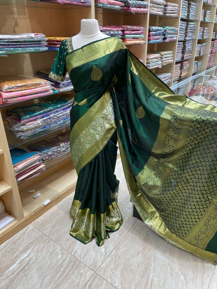 Feel beautiful and stylish in this traditional Kanjeevaram Silk Saree NK-001! Featuring bold floral designs on ultra-soft fabric, this luxurious saree is designed to make you feel like royalty. Perfect for special occasions, it's a timeless classic that will make you shine. Elegant Paithani Silk Pre-draped Saree For Designer Wear, Designer Green Pre-draped Saree With Meenakari, Traditional Green Designer Saree, Designer Green Saree With Zari Weaving, Designer Meenakari Pre-draped Saree In Art Silk, Designer Green Paithani Silk Lehenga, Designer Paithani Silk Saree With Meenakari, Bollywood Style Designer Banarasi Silk Traditional Wear, Fitted Meenakari Saree In Traditional Drape