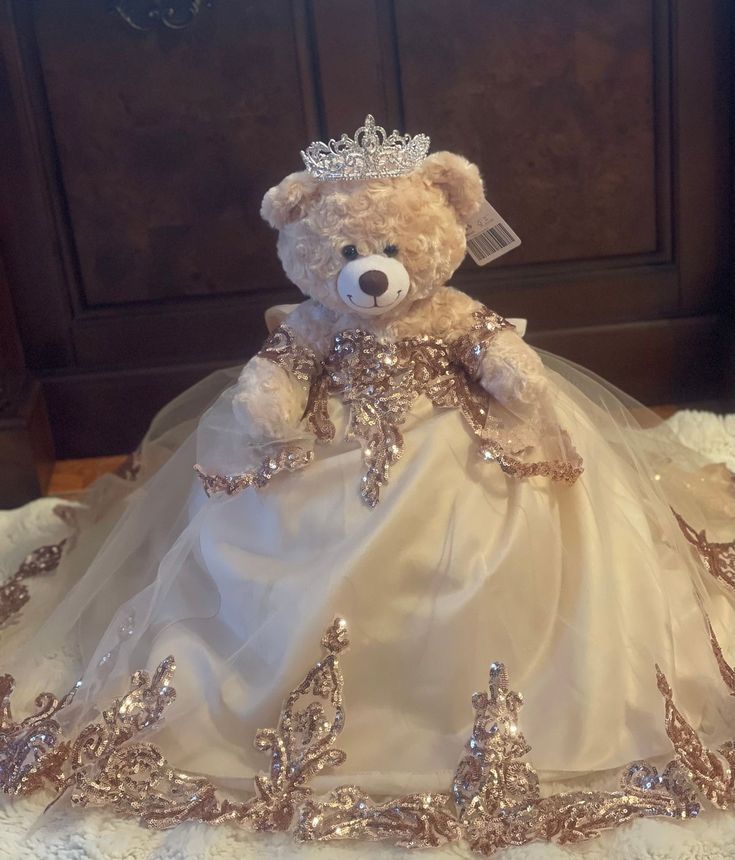 a teddy bear dressed in a wedding dress