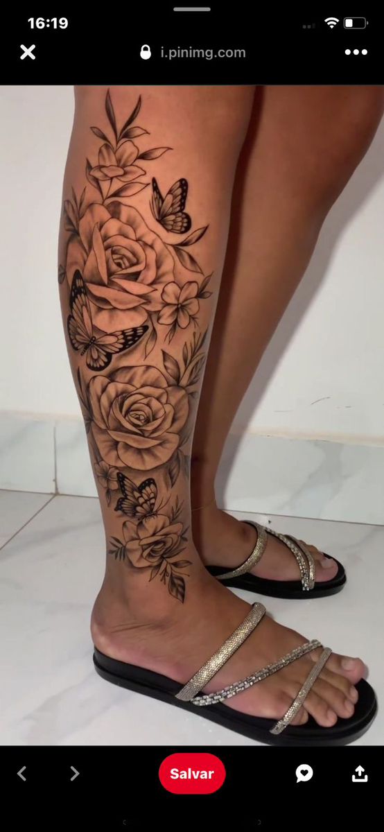 a woman's legs with flowers and butterflies on them