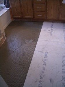 a kitchen floor is being laid out in preparation for remodeling