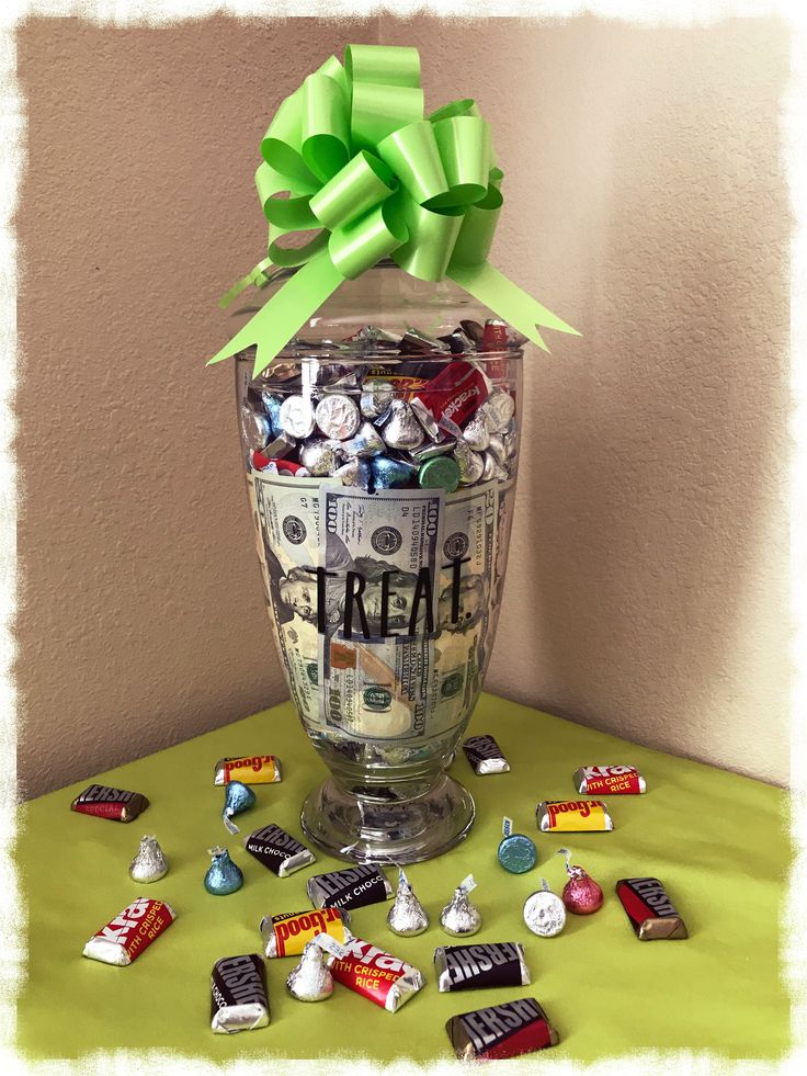 a glass vase filled with candy and candies