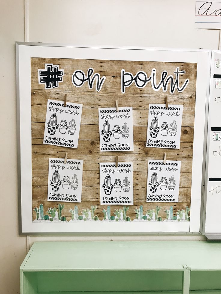 a bulletin board with pictures and writing on it next to a green cabinet in a room