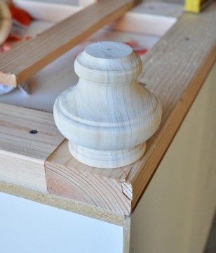 a wooden object sitting on top of a table next to other woodworking tools and supplies