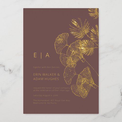 an elegant wedding card with gold foil leaves on the front and bottom, in dark brown