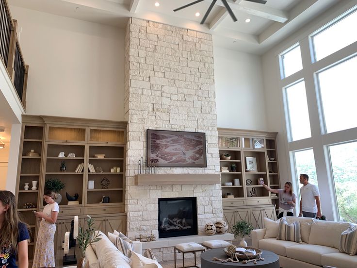 two people are standing in the living room