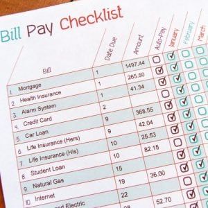 a bill pay checklist sitting on top of a table