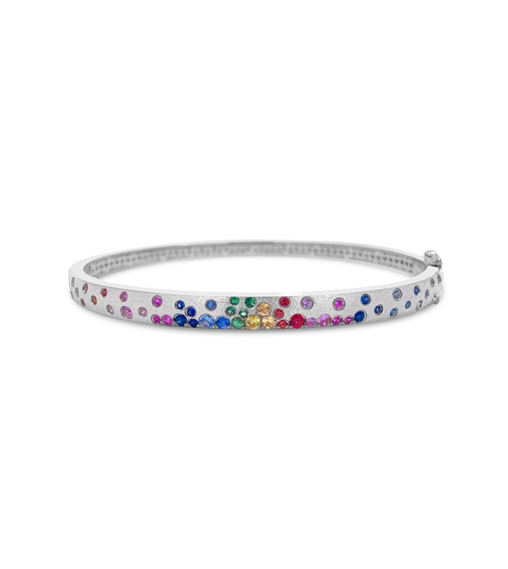 Be mesmerized by this unique bangle! Crafted from 14k gold with a satin finish, this slim band sparkles with scintillating rainbow sapphires. Perfect for wearing alone or stacking with other trinkets, this size 7 beauty is sure to elevate any look! Rainbow Bangles, Cheap Rainbow Bangle Bracelets, Bohemian Rainbow Bangle Bracelet, Adjustable Rainbow Bangle, Rainbow Multi-stone 14k Gold Jewelry, Unique Bangle, Rainbow Sapphires, Satin Finish, Sapphire