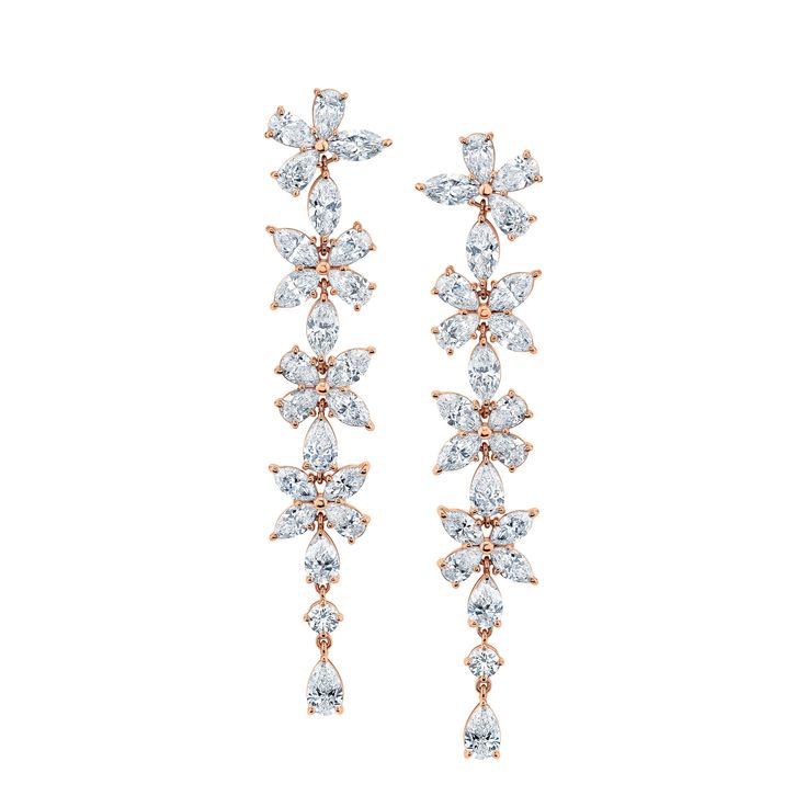 Add a touch of elegance to your wardrobe with our exquisite Long Floral Diamond Earrings, crafted in 18k white gold. The stylish drop design features a stunning floral motif, adorned with dazzling diamonds that effortlessly catch the light with every move. Diamond Flower-shaped Earrings For Formal Occasions, Luxury Flower-shaped Diamond Earrings For Formal Occasions, Exquisite Diamond Flower-shaped Earrings, Luxury White Diamond-cut Chandelier Earrings, Fine Jewelry Flower-shaped Cluster Earrings In Cubic Zirconia, Drops Design, Floral Motif, Diamond Earrings, White Gold