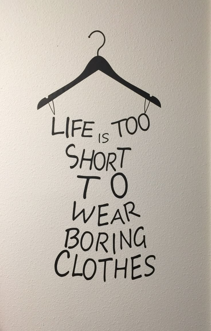 a black and white drawing of a hanger with the words life is too short to wear boring clothes