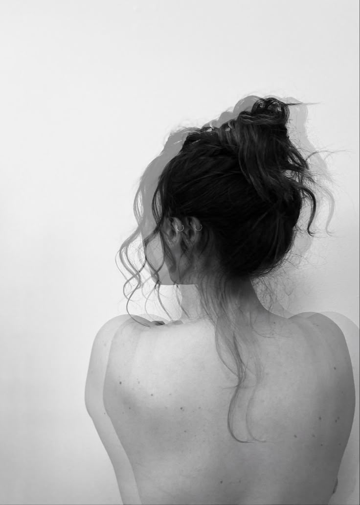 black and white photograph of a woman's back