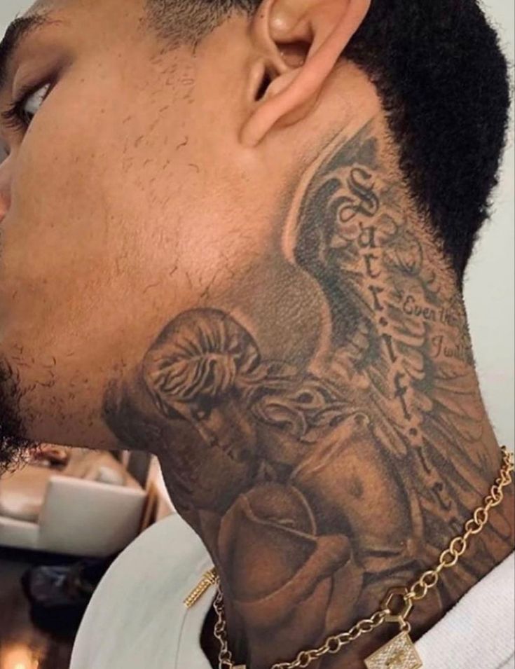 a man with a tattoo on his neck